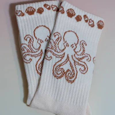 A pair of octopus socks laid flat